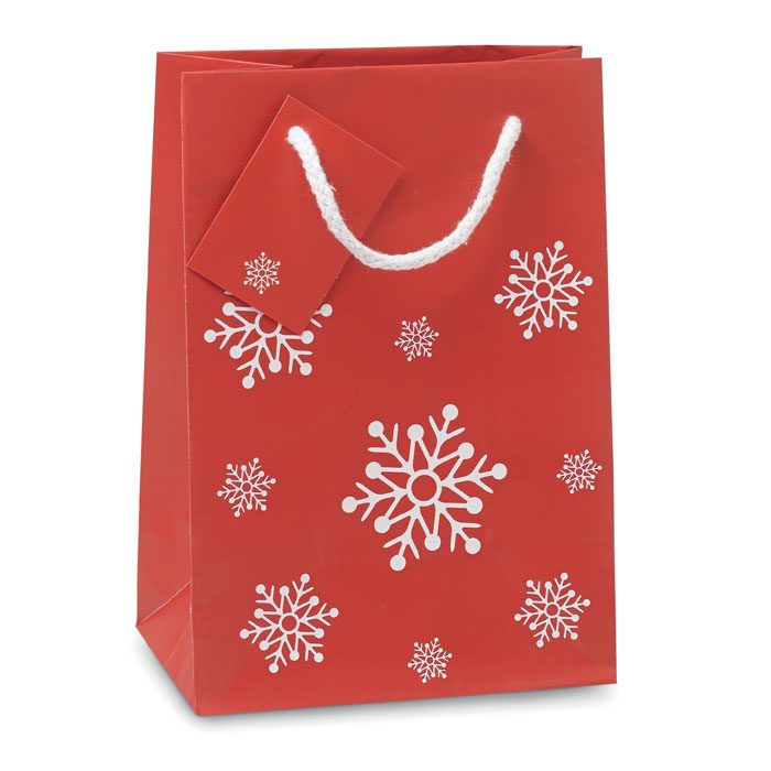 Bolsa de regalo roja con copos de nieve, ideal para promociones y eventos, personalizable con logo de empresas.
